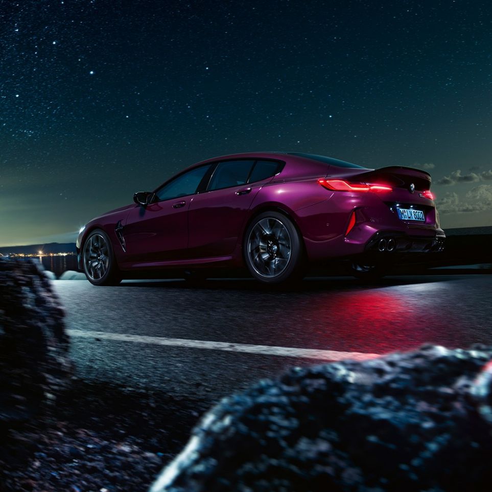 BMW M8 Competition Gran Coupé three-quarter rear view low angle shot BMW M8 Competition Gran Coupé F93 2020 BMW Individual Ametrine metallic three-quarter rear view low angle shot