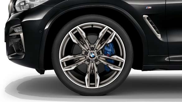 BMW X3 M40i M Sport brakes. BMW X3 M40i in Black Sapphire metallic, exterior, light alloy wheel with M Sport brake.