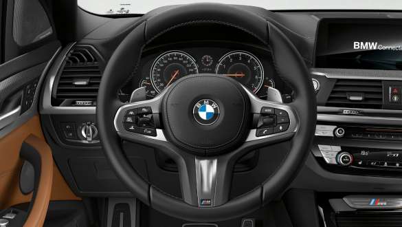 BMW X3 M40i Variable sport steering. BMW X3 M40i interior, cockpit, M leather steering wheel, Variable sport steering.