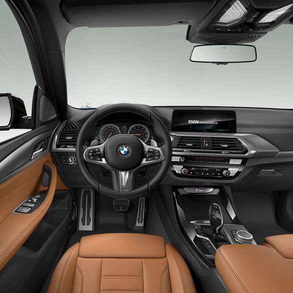 BMW X3 M40i interior, cockpit with M leather steering wheel and M Sport seats. BMW X3 M40i cockpit.