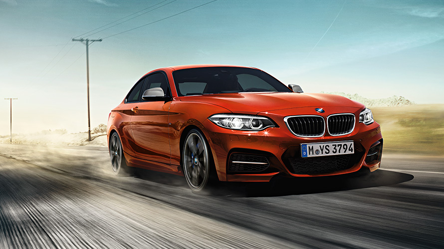 BMW 2 Series Coupé F22 three-quarter front view driving on the street BMW 2 Series BMW 2 Series Coupé F22 three-quarter front view driving on the street