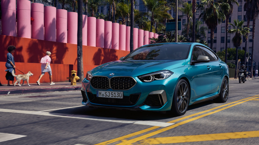 BMW 2 Series Gran Coupé F44 three-quarter front view driving on the street BMW 2 Series BMW 2 Series Gran Coupé F44 three-quarter front view driving on the street