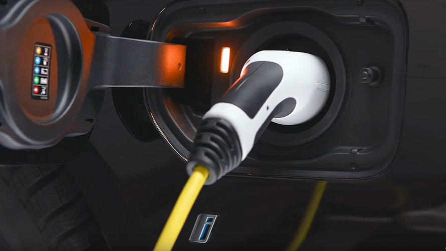 BMW plug-in hybrid connected with charging cable BMW plug-in hybrid connected with charging cable
