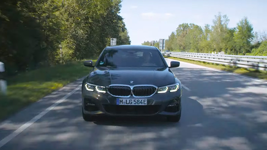 BMW plug-in hybrid driving on road BMW plug-in hybrid driving on road