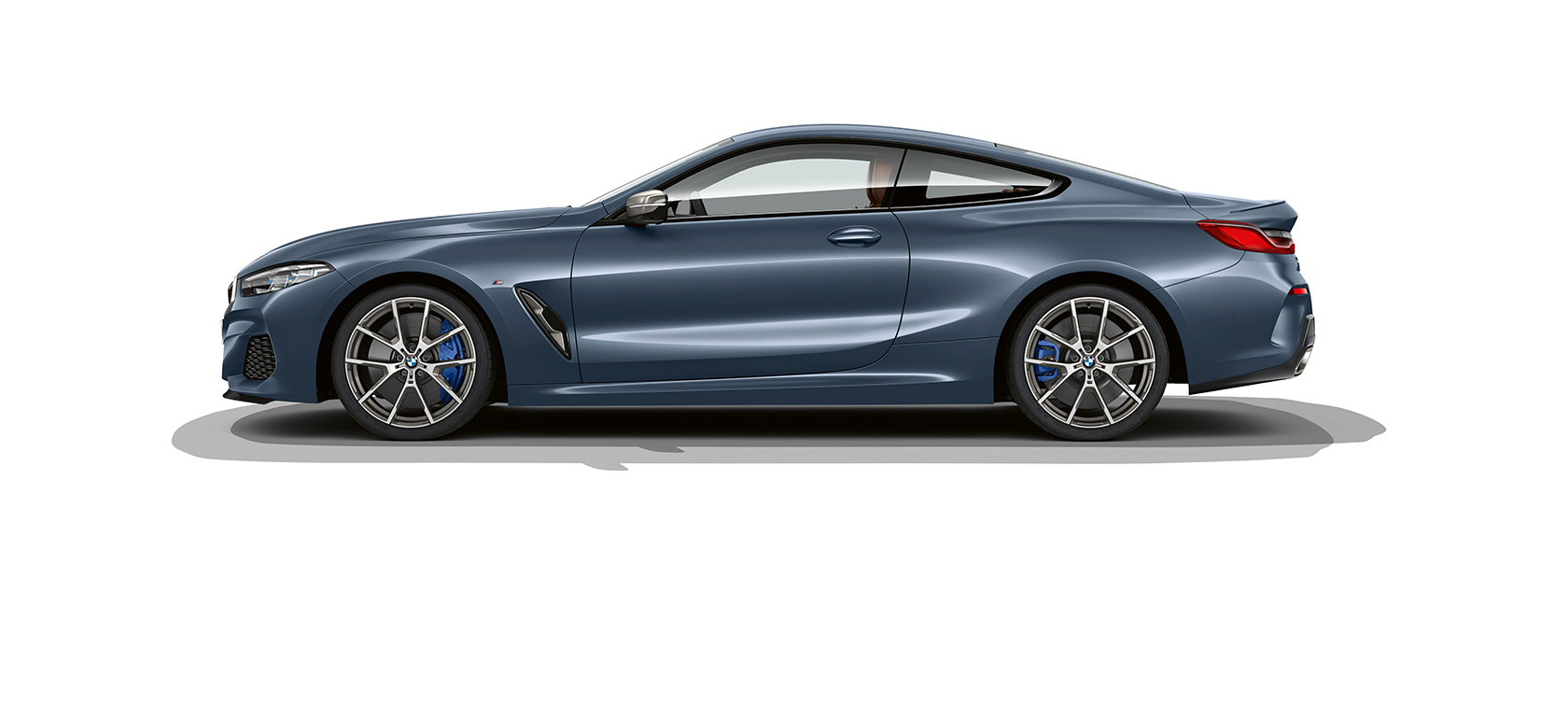 Still shot of the BMW 8 Series Coupé Still shot of the BMW 8 Series Coupé from the side against a white background.