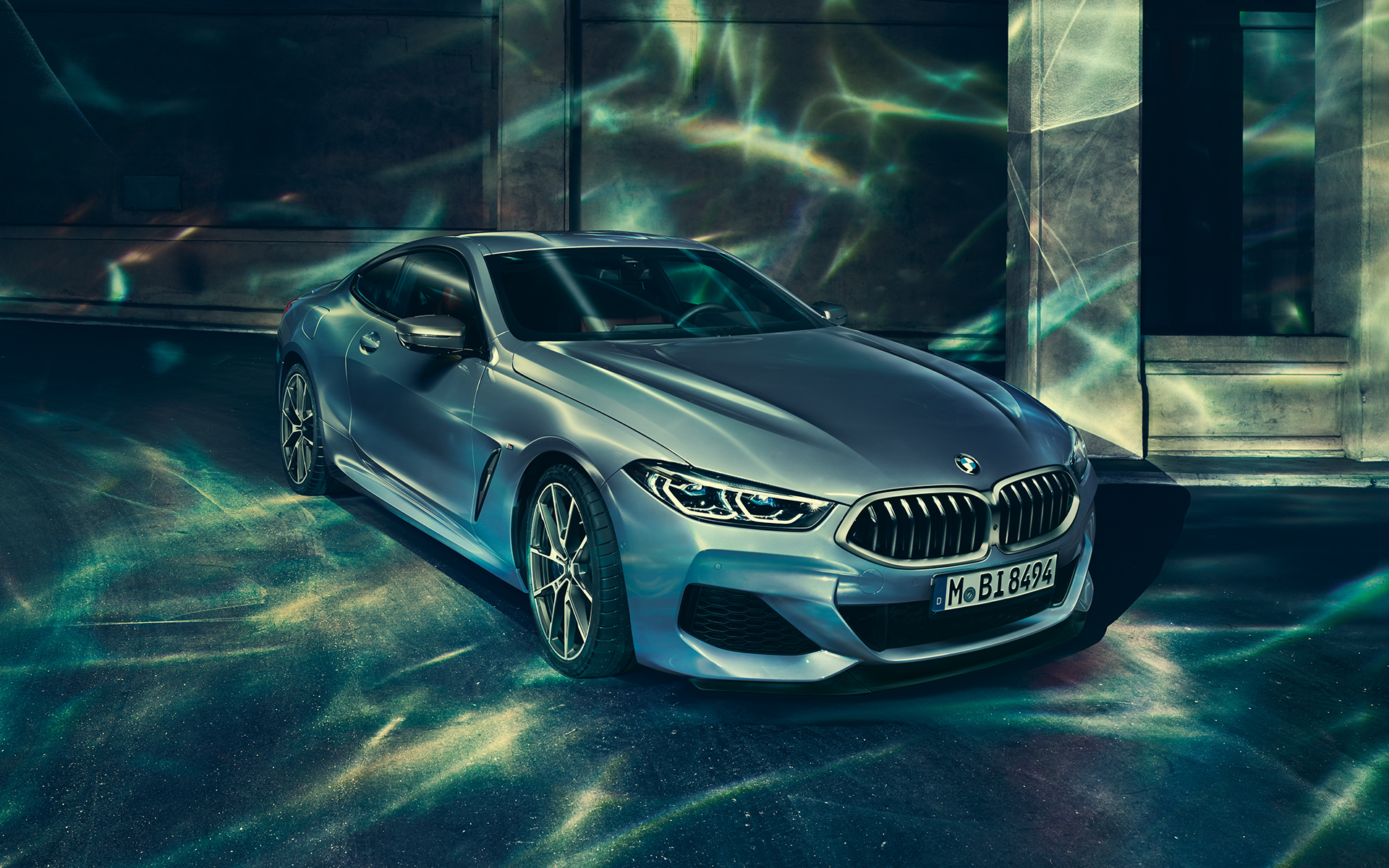 BMW 8 Series Coupé, three-quarter front-left A three-quarter front-left still shot of the BMW 8 Series Coupé in an urban setting.