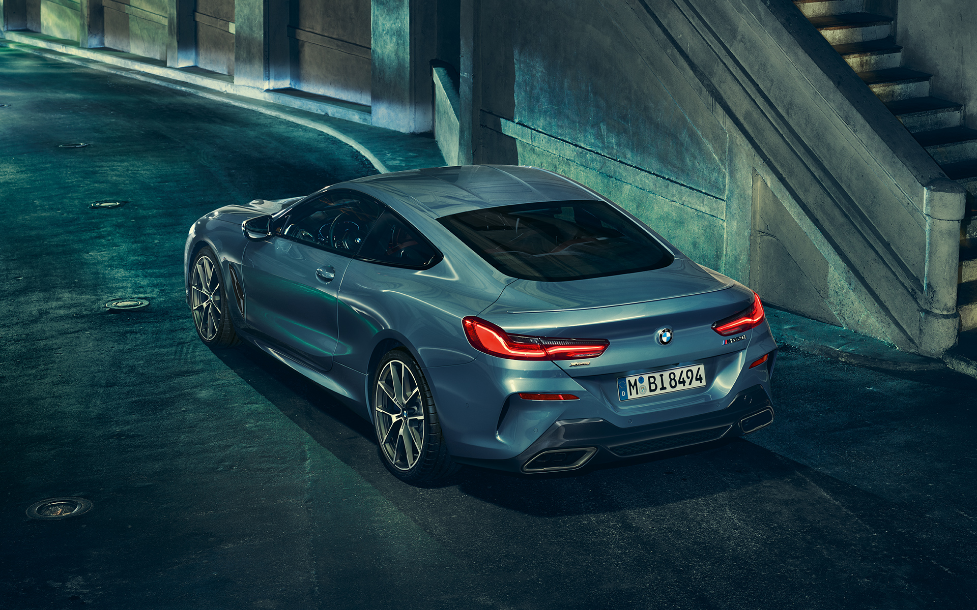 BMW 8 Series Coupé, three-quarter back A three-quarter back-left still shot of the BMW 8 Series Coupé in an urban setting.