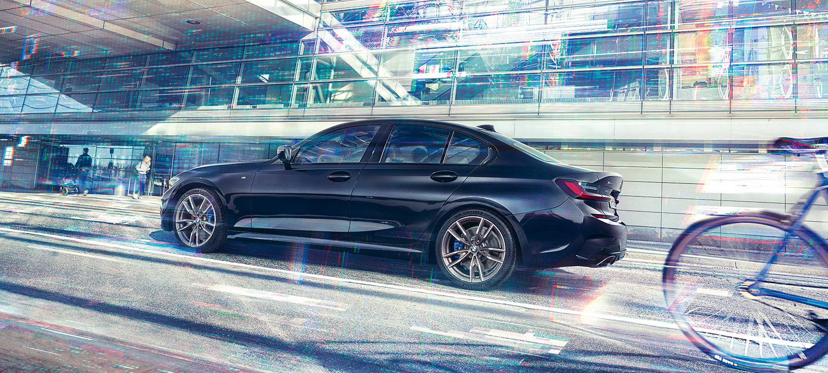 BMW M340i xDrive Sedan G20 2020 side view in motion BMW M340i xDrive Sedan G20 2020 Sapphire Black metallic side view in motion