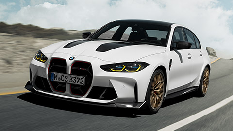 BMW M3 G80 front view dirivng on the street BMW M Series BMW M3 G80 front view dirivng on the street