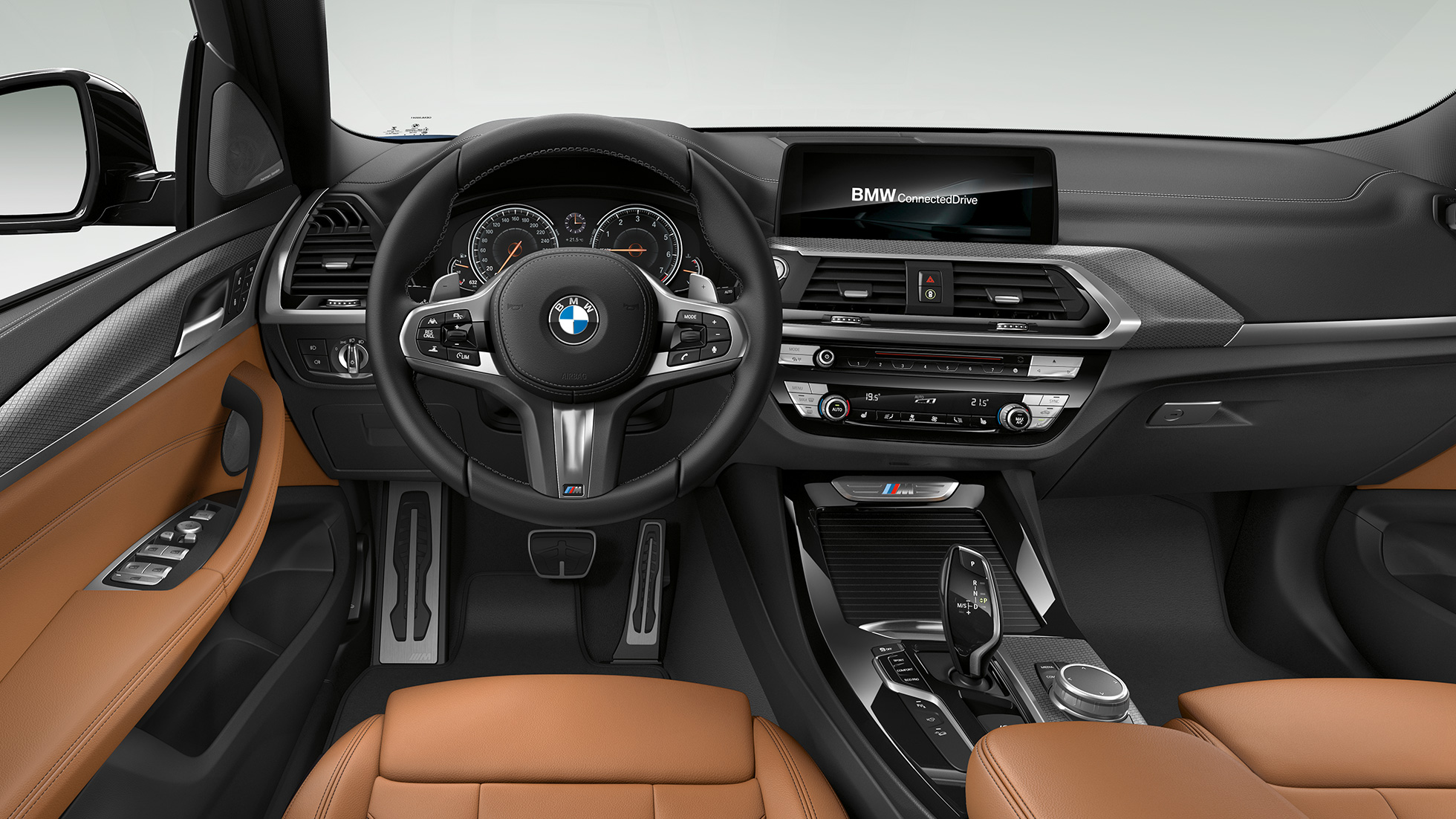 BMW X3 M40i interior, cockpit with M leather steering wheel and M Sport seats. BMW X3 M40i cockpit.