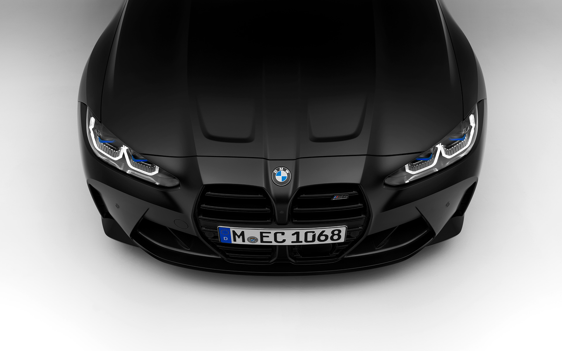 BMW M4 Competition Coupé G82 2021 BMW Individual Frozen Black metallic front view BMW M4 Competition Coupé G82 2021 BMW Individual Frozen Black metallic standing front view in section from above