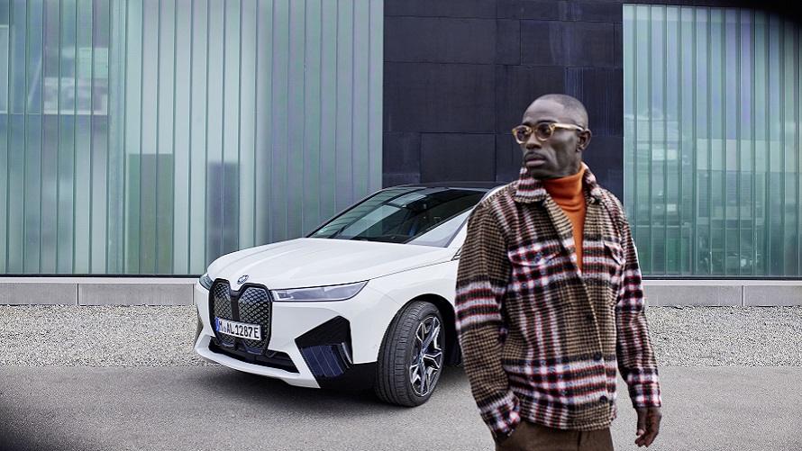 Diversity BMW Sustainability BMW Sustainability Diversity BMW vehicle front view in rainbow colors with open gull-wing doors