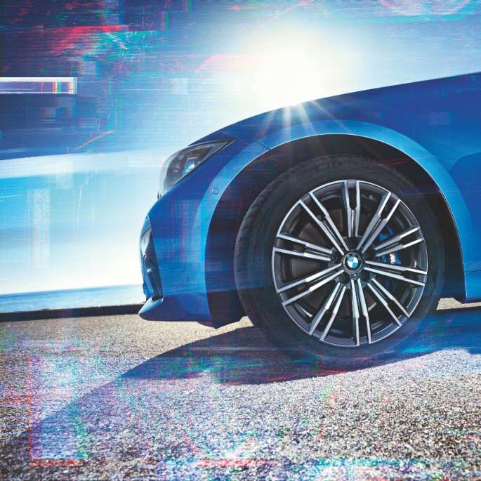 BMW 3 Series Sedan, Model M Sport light alloy wheel. Close-up of the light alloy wheel of the BMW 3 Series Sedan with Model M Sport equipment.